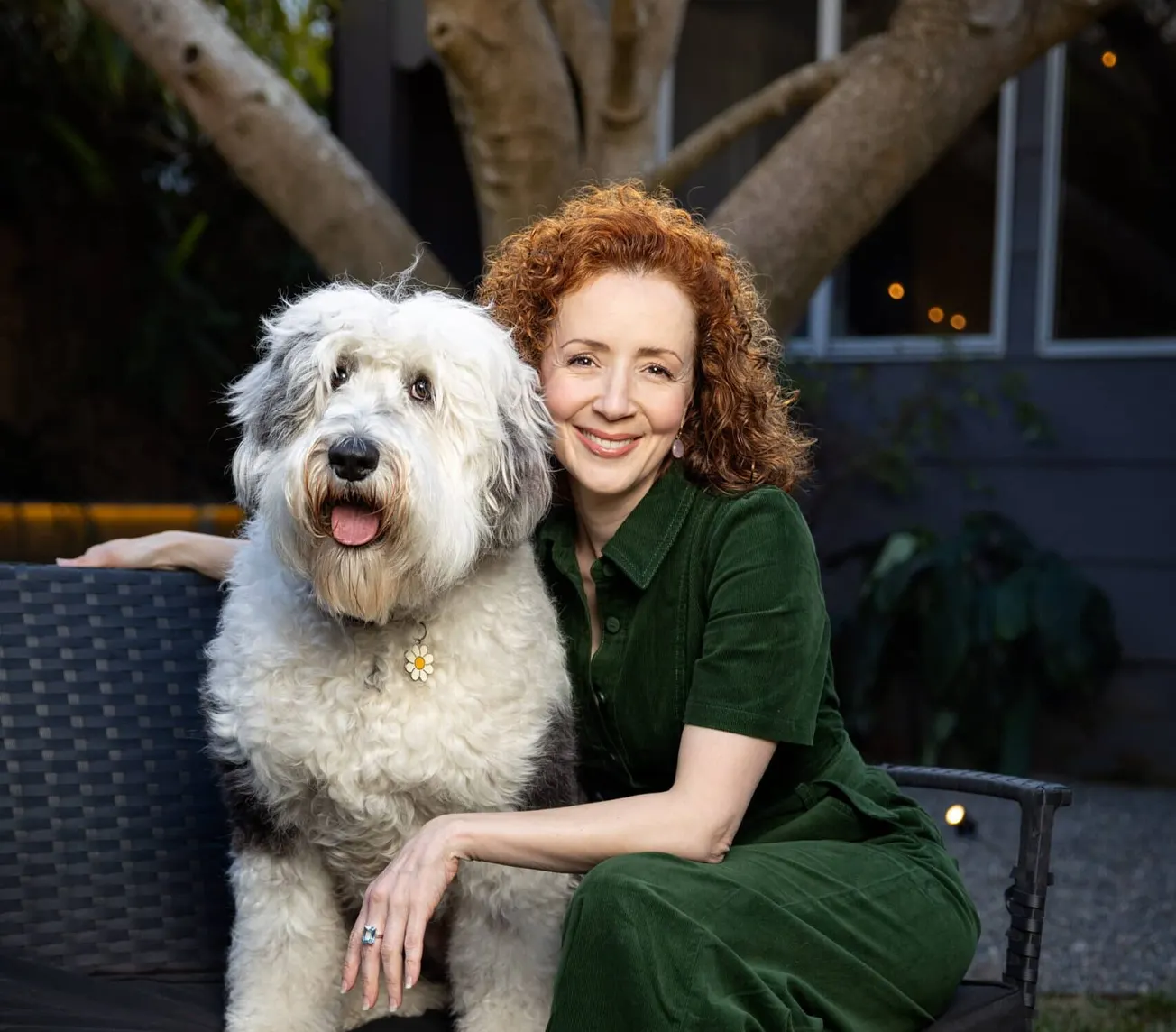 Ana Maria Belo smiling with her dog Patti