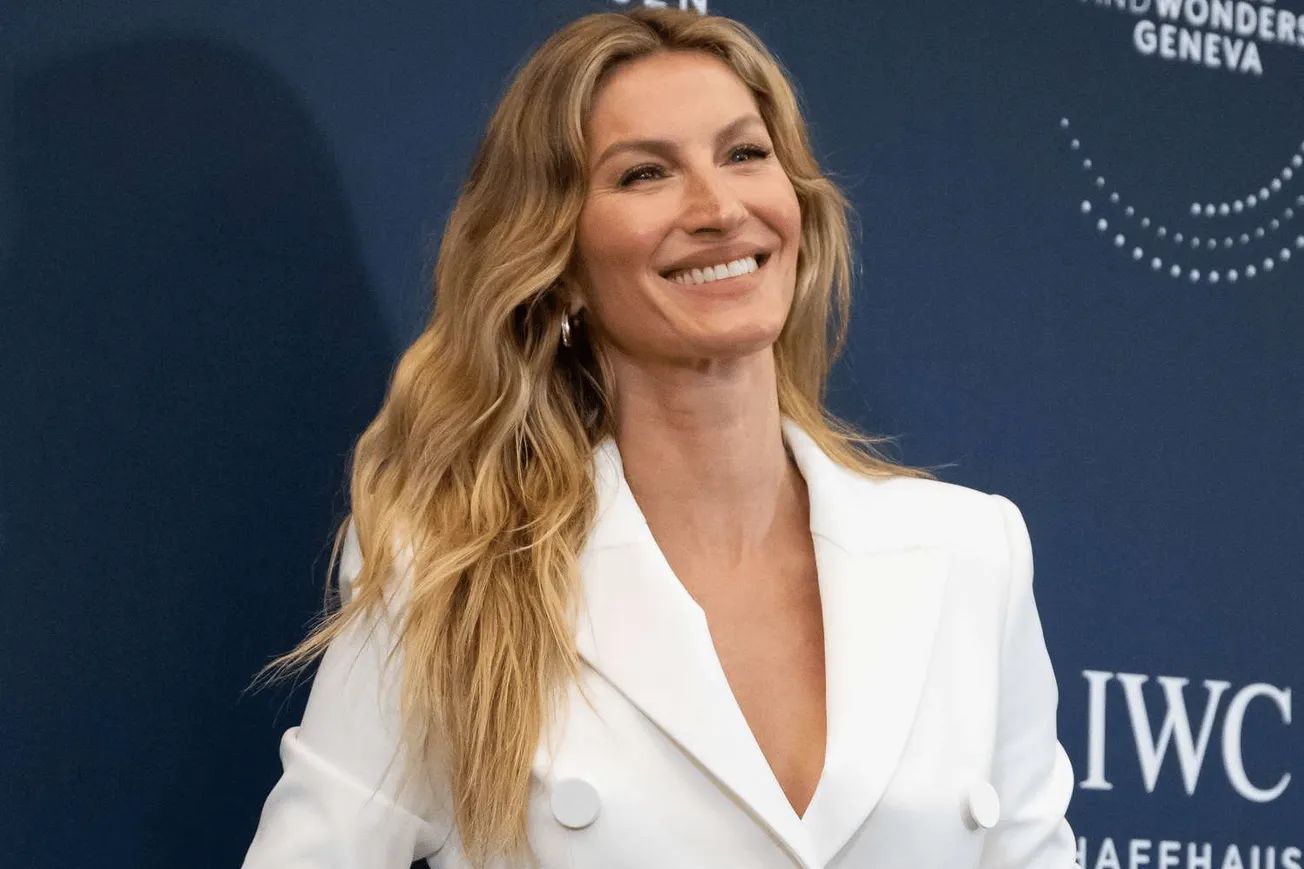 a close up photo of IWC ambassador Gisele Bündchen smiling at a Watch event in Geneva, Switzerland