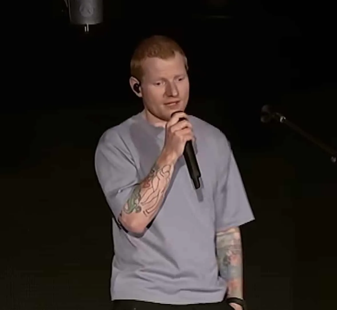 Ed Sheeran speaking on stage at his Philadelphia tour