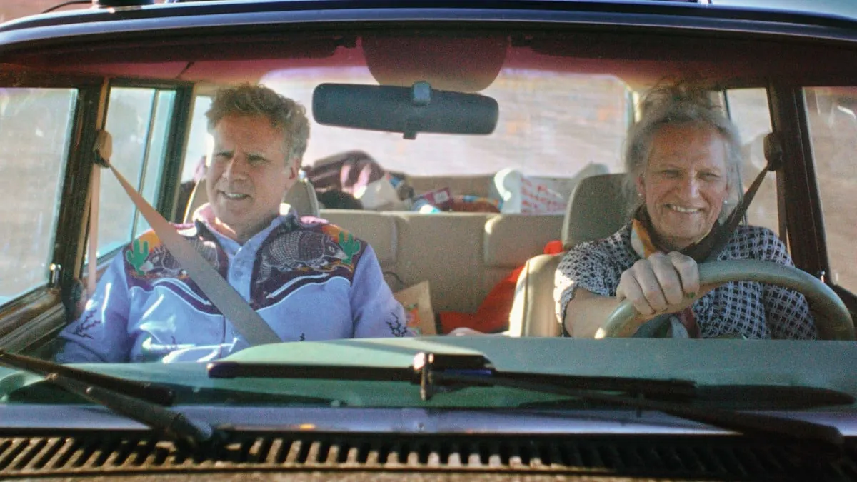 a still of Will Ferrell and Harper Steele in a car laighing together