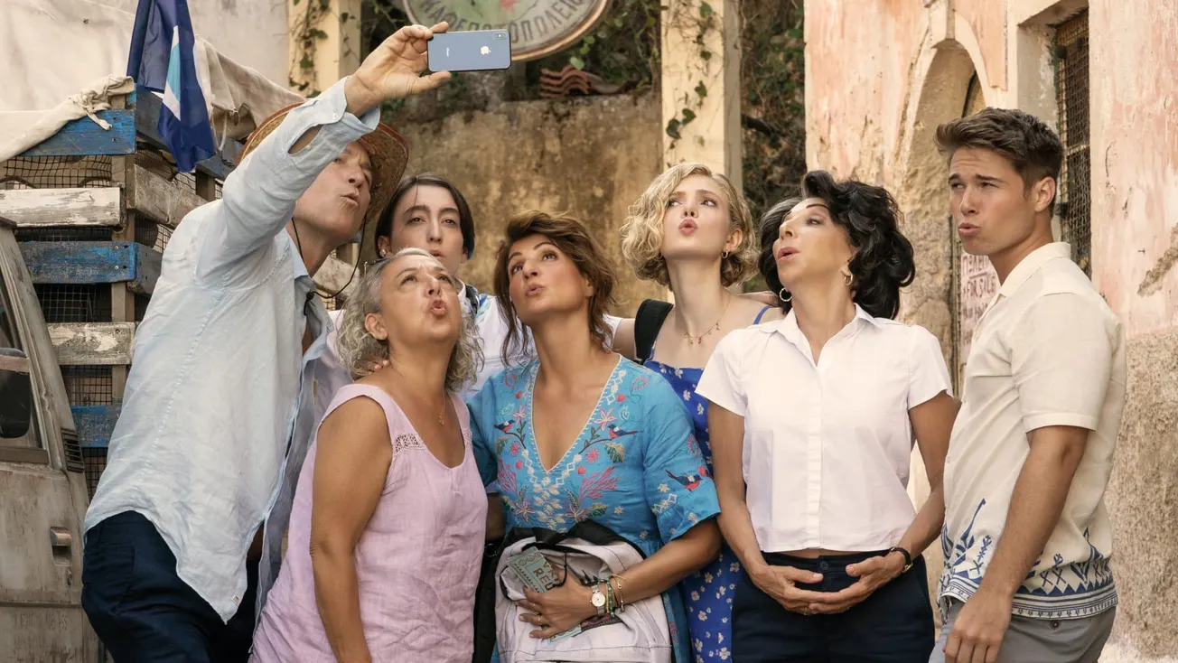 the cast of My Big Fat Greek Wedding 3 on set pose for a selfie