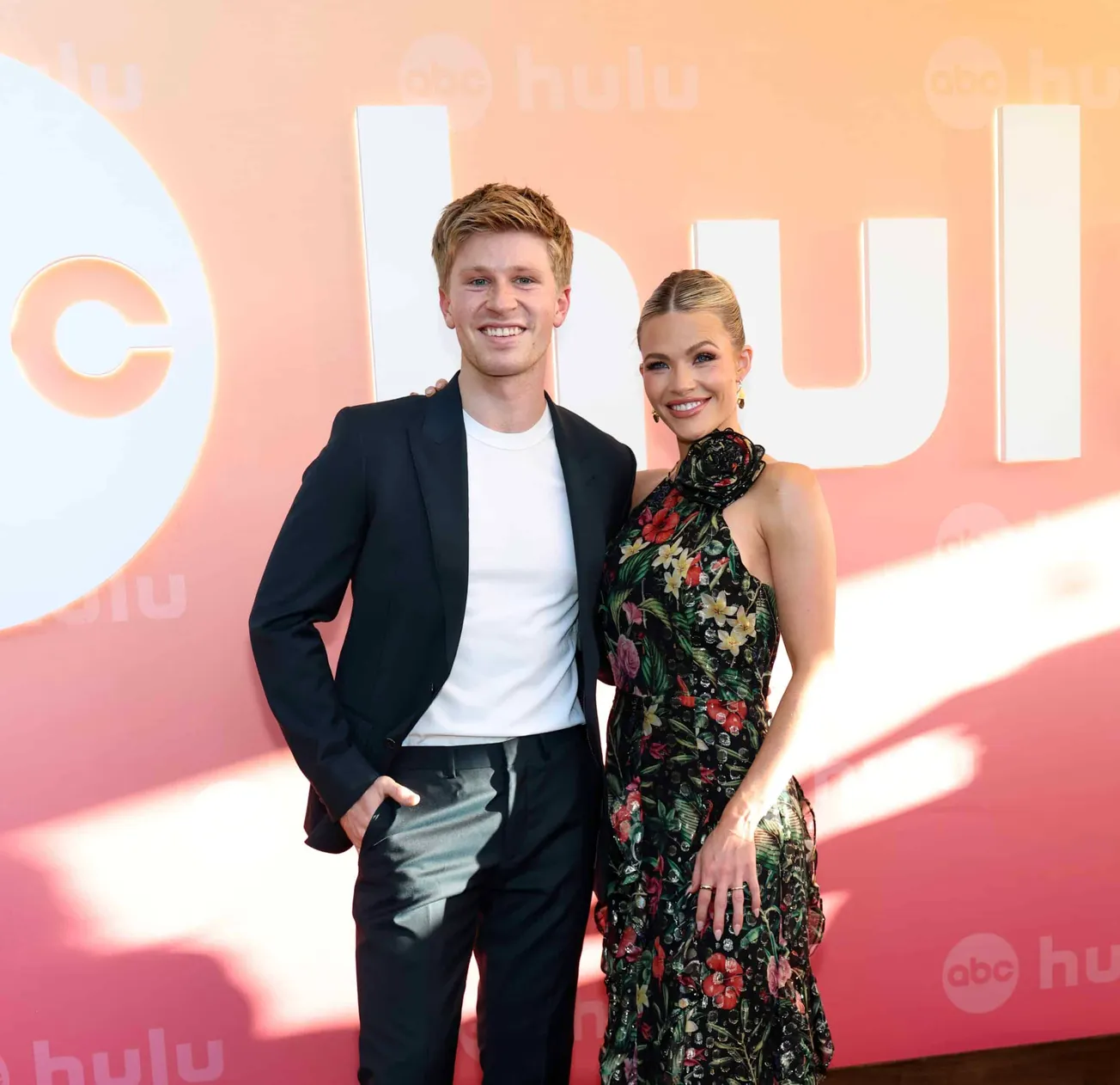 Robert Irwin and Witney Carson smile together at a red carpet event