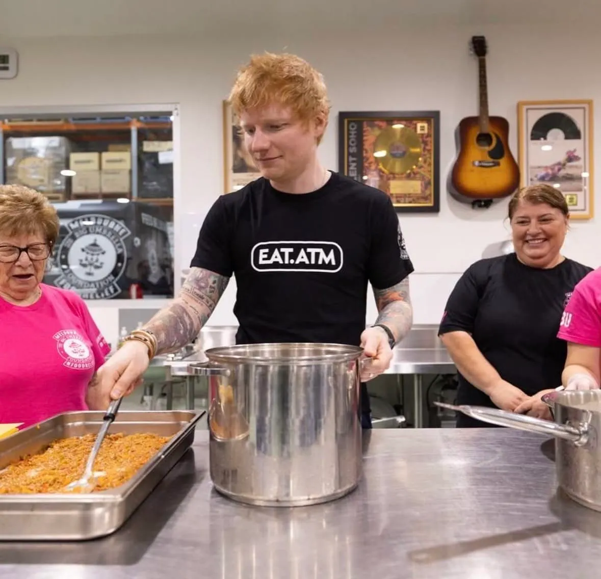 Ed Sheeran at The Big Umbrella in Brunswick, preparing meals.