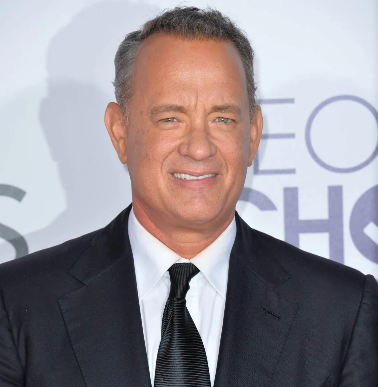 Tom Hanks smiles at a press event