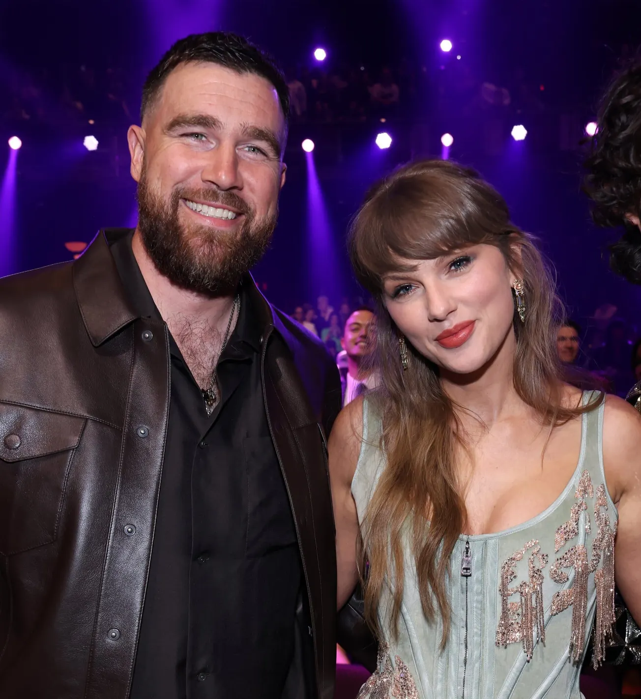Travis Kelce and Taylor Swift smiling at a red carpet event in 2026