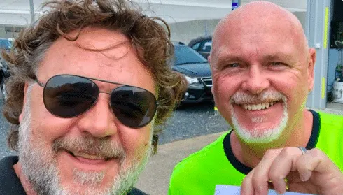 Russell Crowe hands over cheques to RFS Captain John Ladner