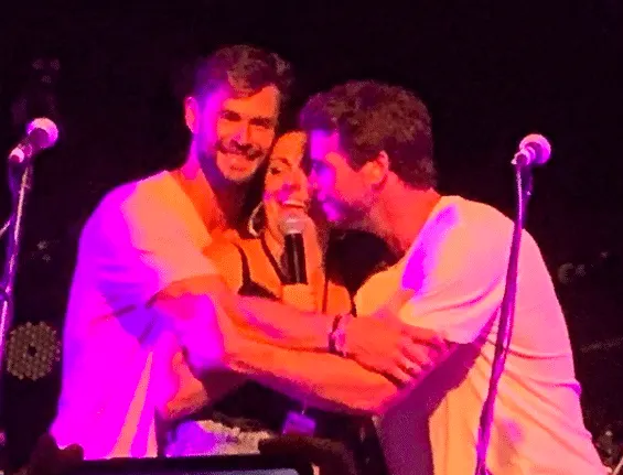 Chris and Liam Hemsworth hug Celeste Barber at Make It Rain:Fund the Firies 2020 (Photo: @enkoala/Instagram)