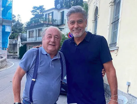An Italian local with George Clooney in Laglio after the 2021 flooding.