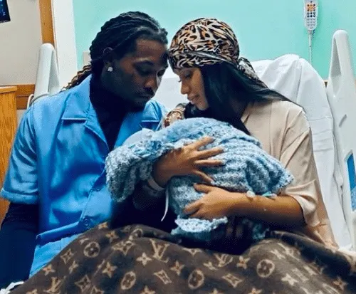 Cardi B and Offset cradle their newborn in hospital.