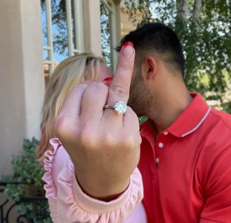 Britney Spears and Sam Asghari engaged! In the photo Britney sticks up her ring finger at the camera while kissing Sam in the