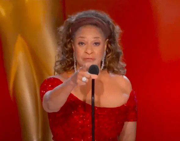Debbie Allen wears red and points at the camera at the 2021 Emmys.