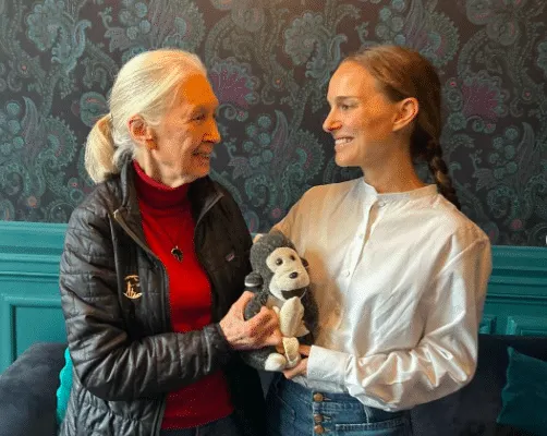 Dr Jane Goodall pictured with Natalie Portman, looking at each other and smiling