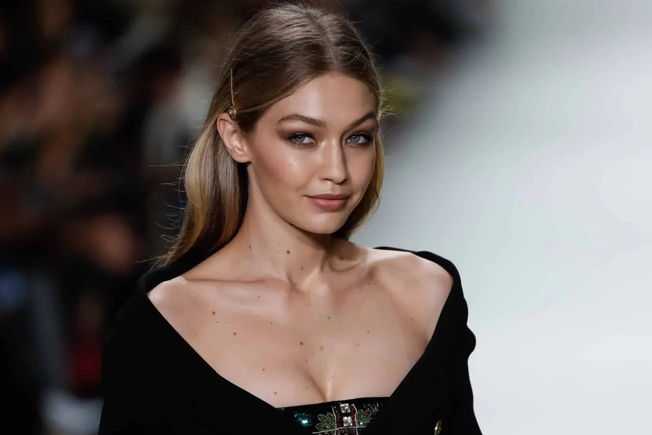 Gigi Hadid hair inspo, Long hair parted int he middle and pinned behind her ears
