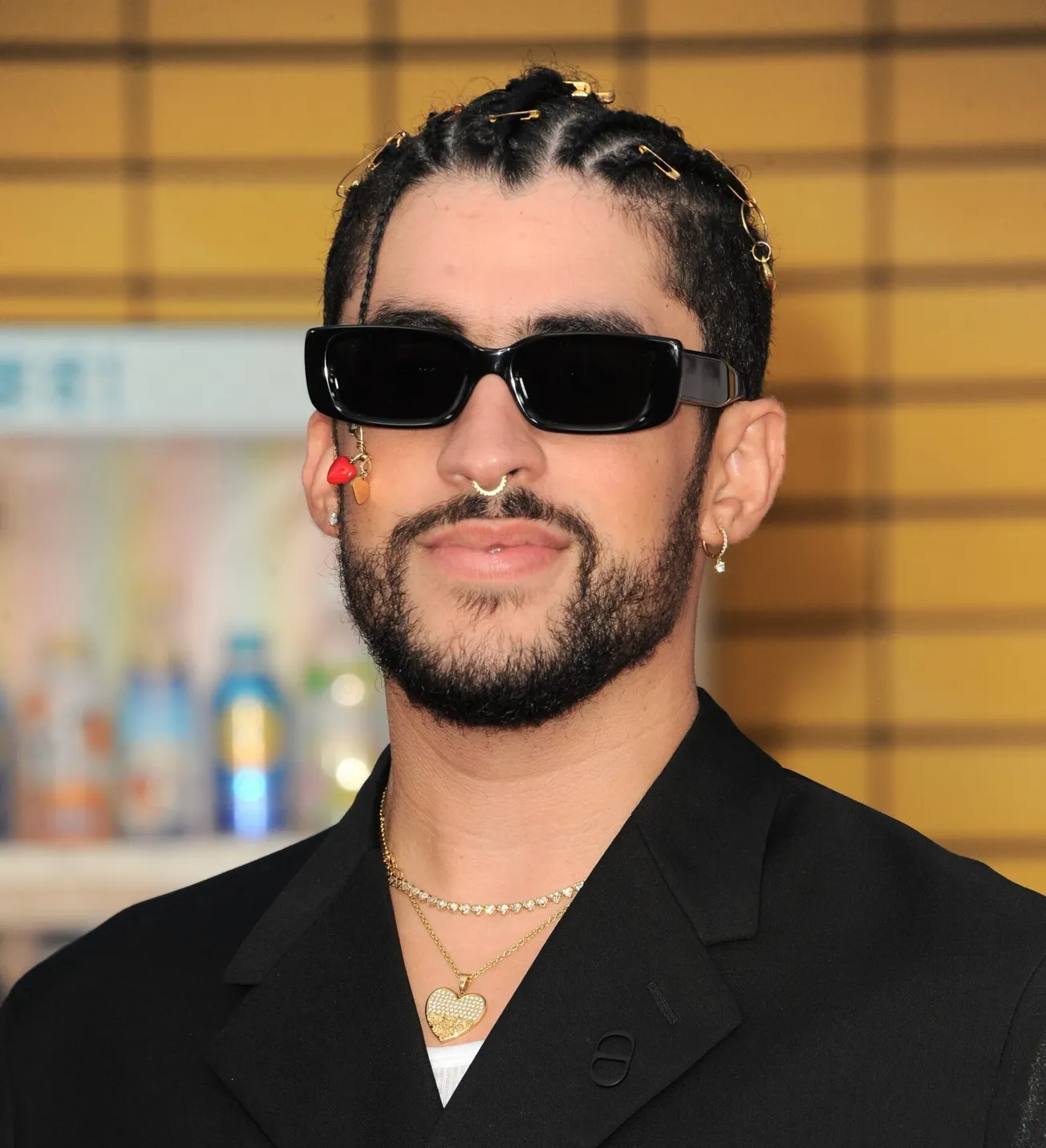 A close up of Bad Bunny wearing sunglasses