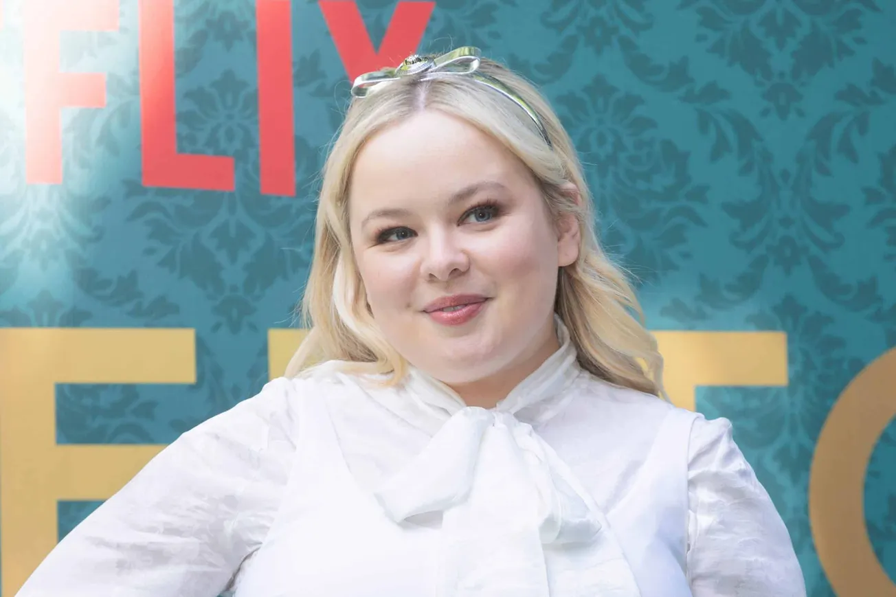 'The Magic Faraway Tree' actor Nicola Coughlan smiles at a press event in 2024 with her head slightly tilted. She has a bow i