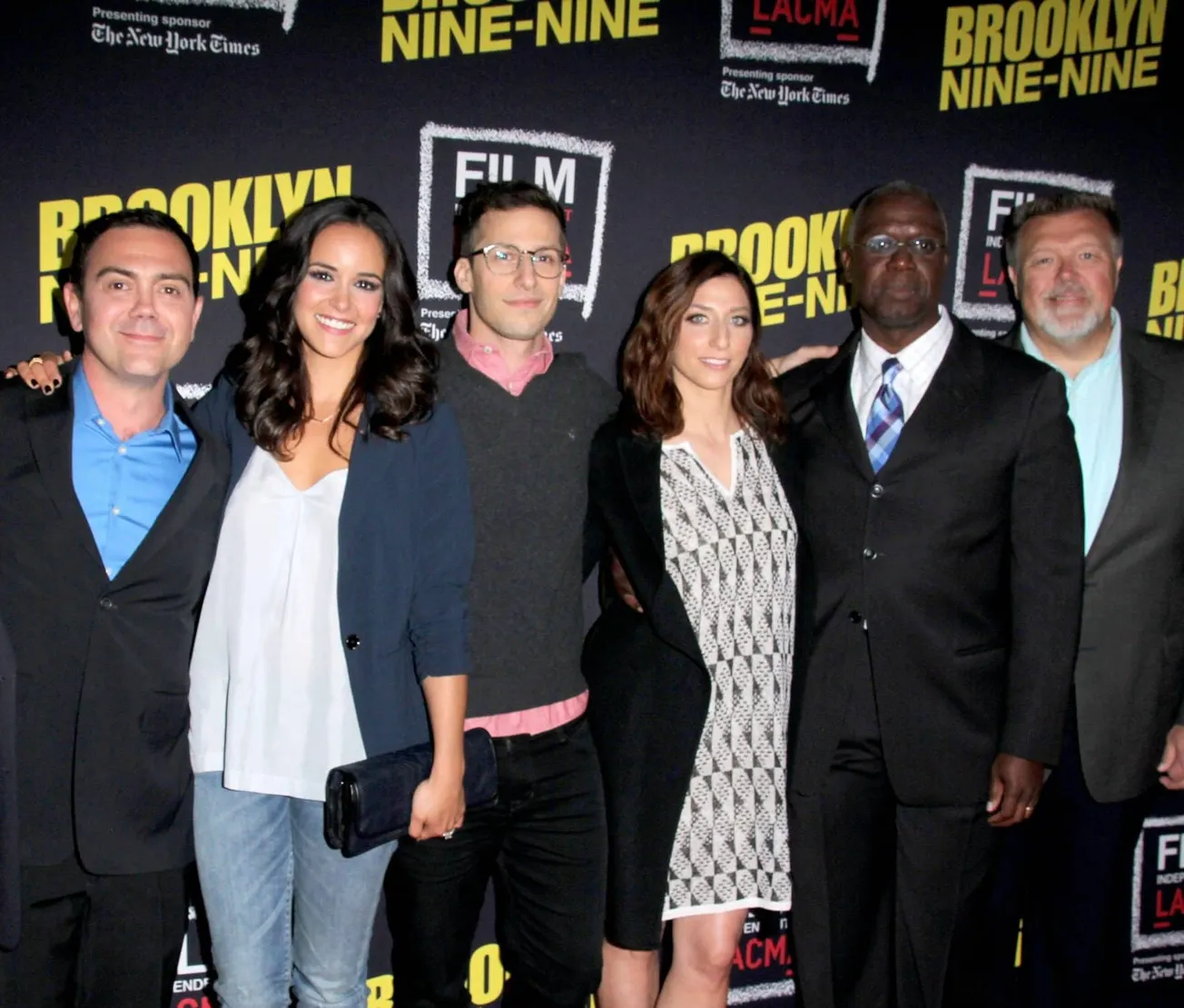 Brooklyn Nine-Nine cast with Andre Braugher, posing together on the red carpet at a press event.