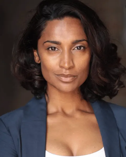 a close up photo of Virginie Laverdure. She has dark brown skin and black curly hair.