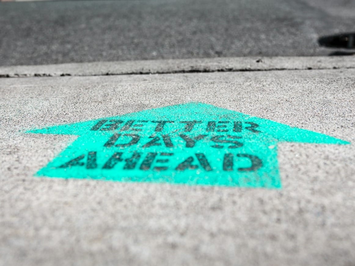 red and black love print on gray concrete floor