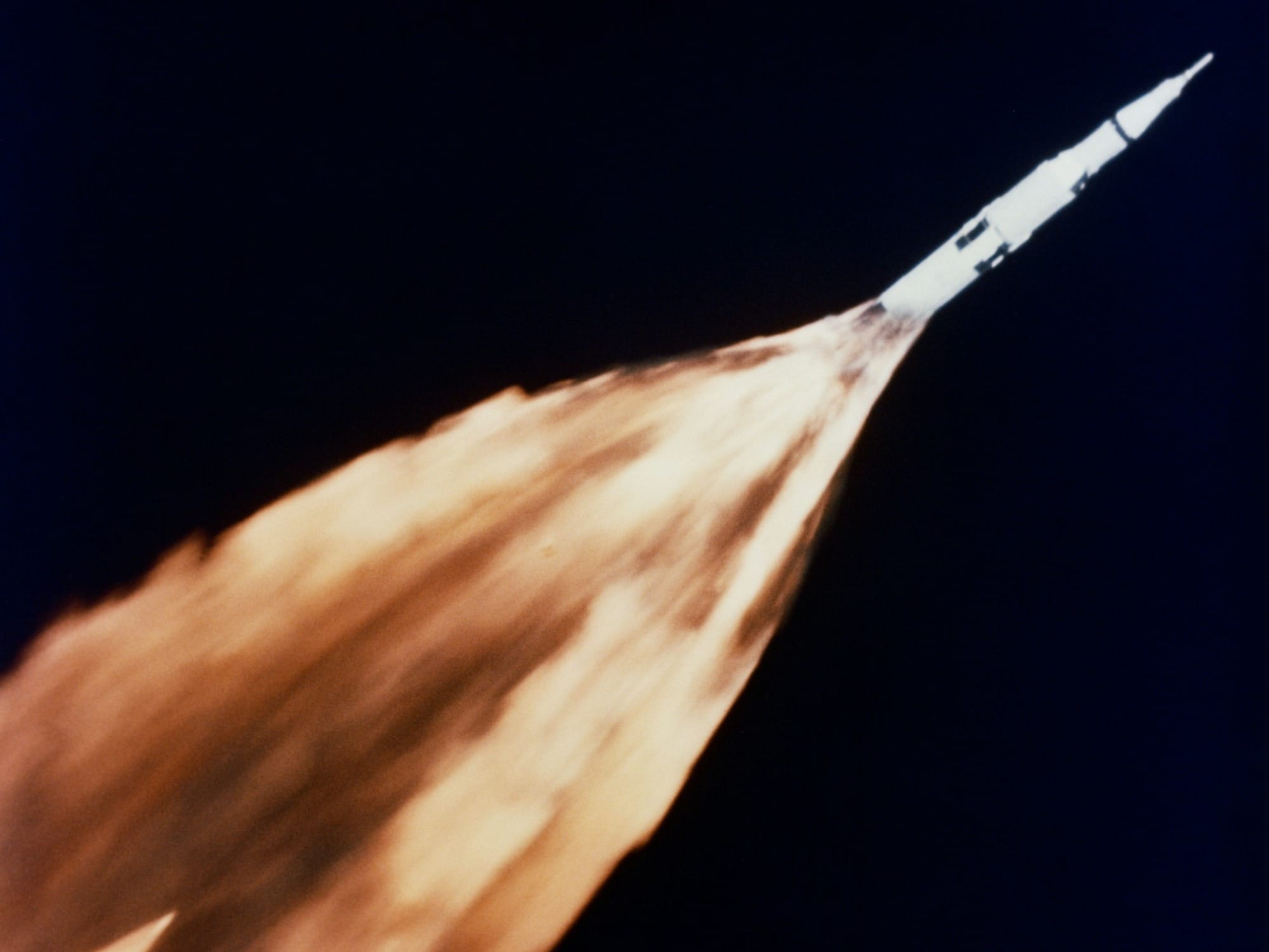 Saturn rocket with a trail of flames during launch
