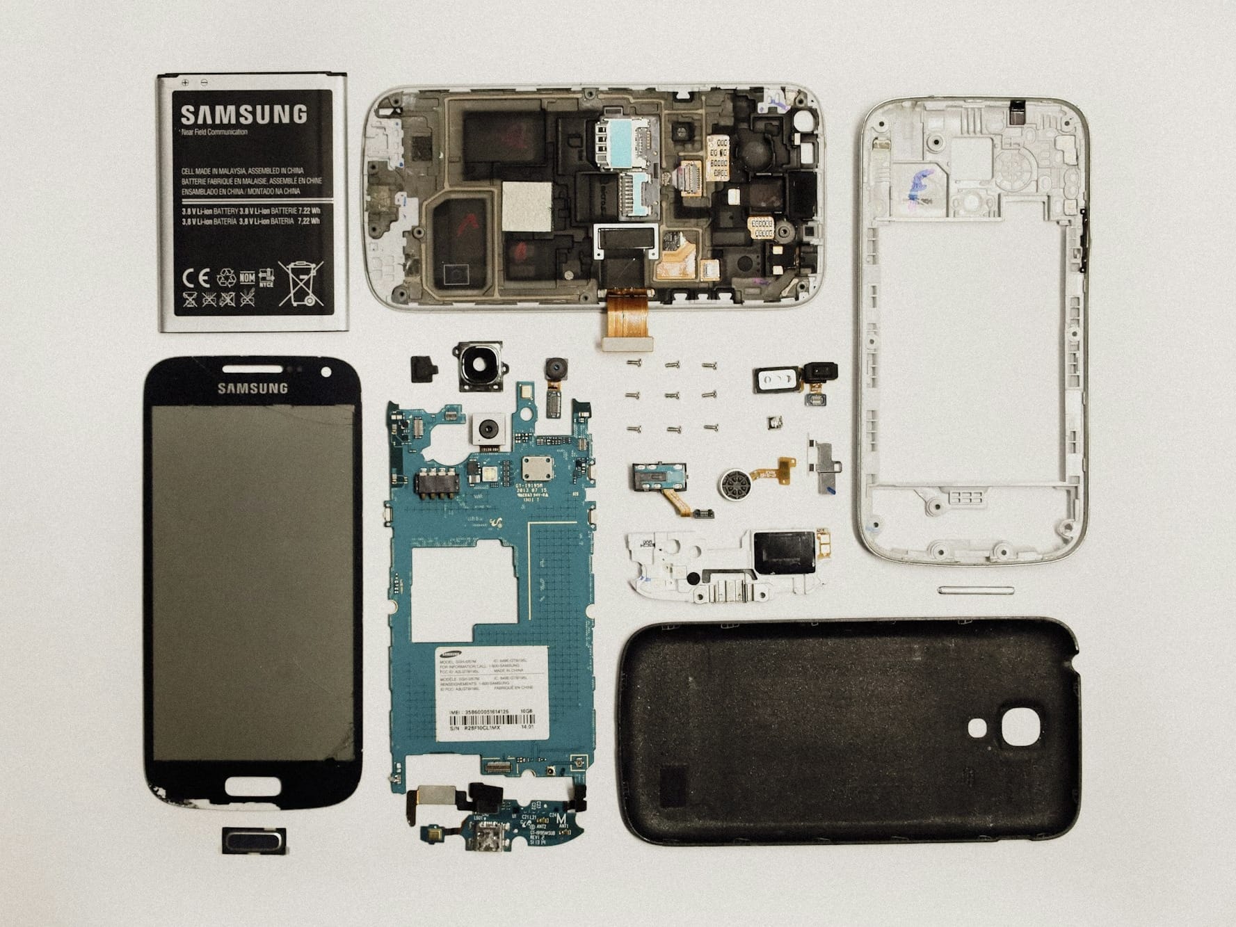 a picture of a cell phone and parts