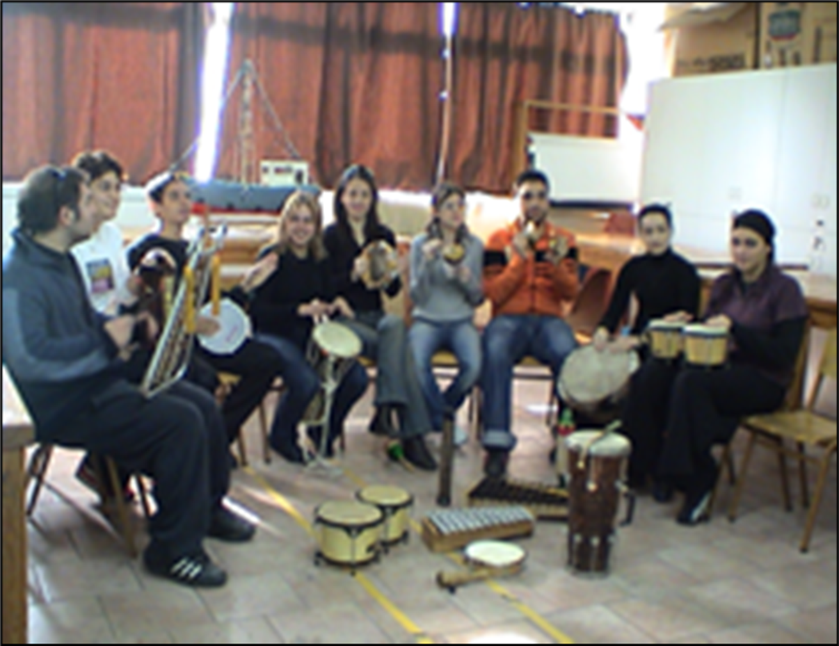 A group of people playing instruments
Description automatically generated with medium confidence