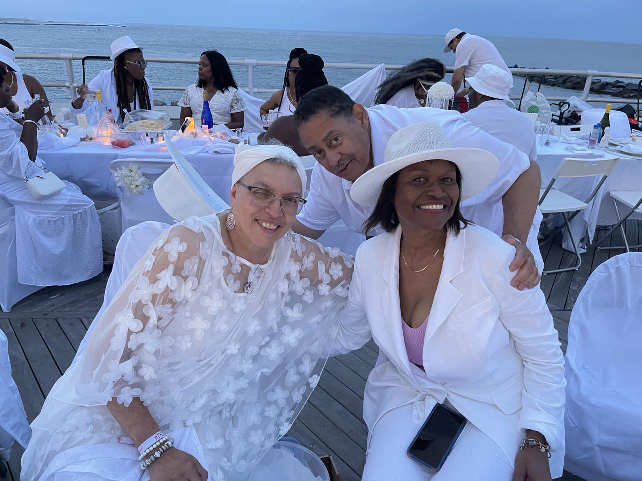 Shermaine Gunter-Gary (Left) Kenny Logan (Center) and Maxzine Logan (Left) enjoy Le Diner en Blanc Atlantic City on the Boardwalk. Photo Credit: Mark Tyler