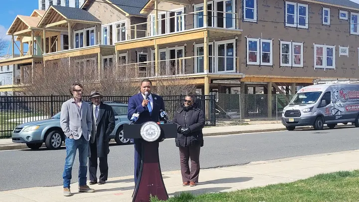 Mayor Marty Small stands at a podium outside of a housing development in Atlantic City, New Jersey.
