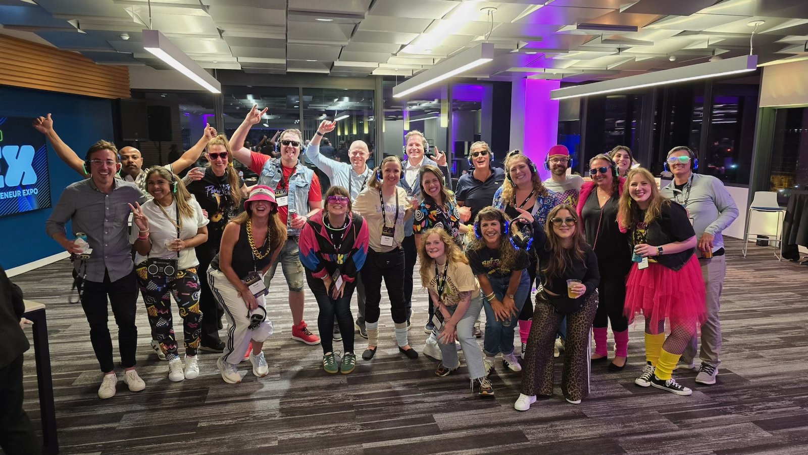 People in 80s outfits dancing to 80s music