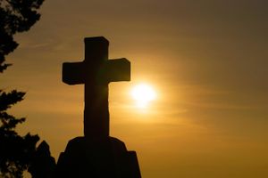 cross image with sunset