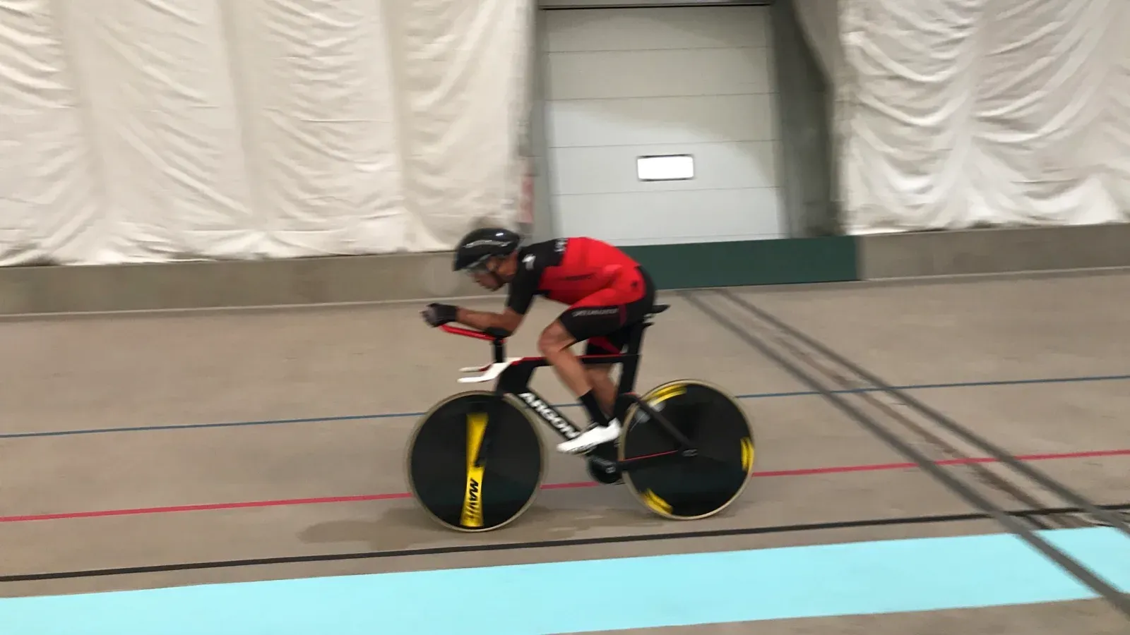 Norm Alvis in the aero position on a track bike at the velodrome