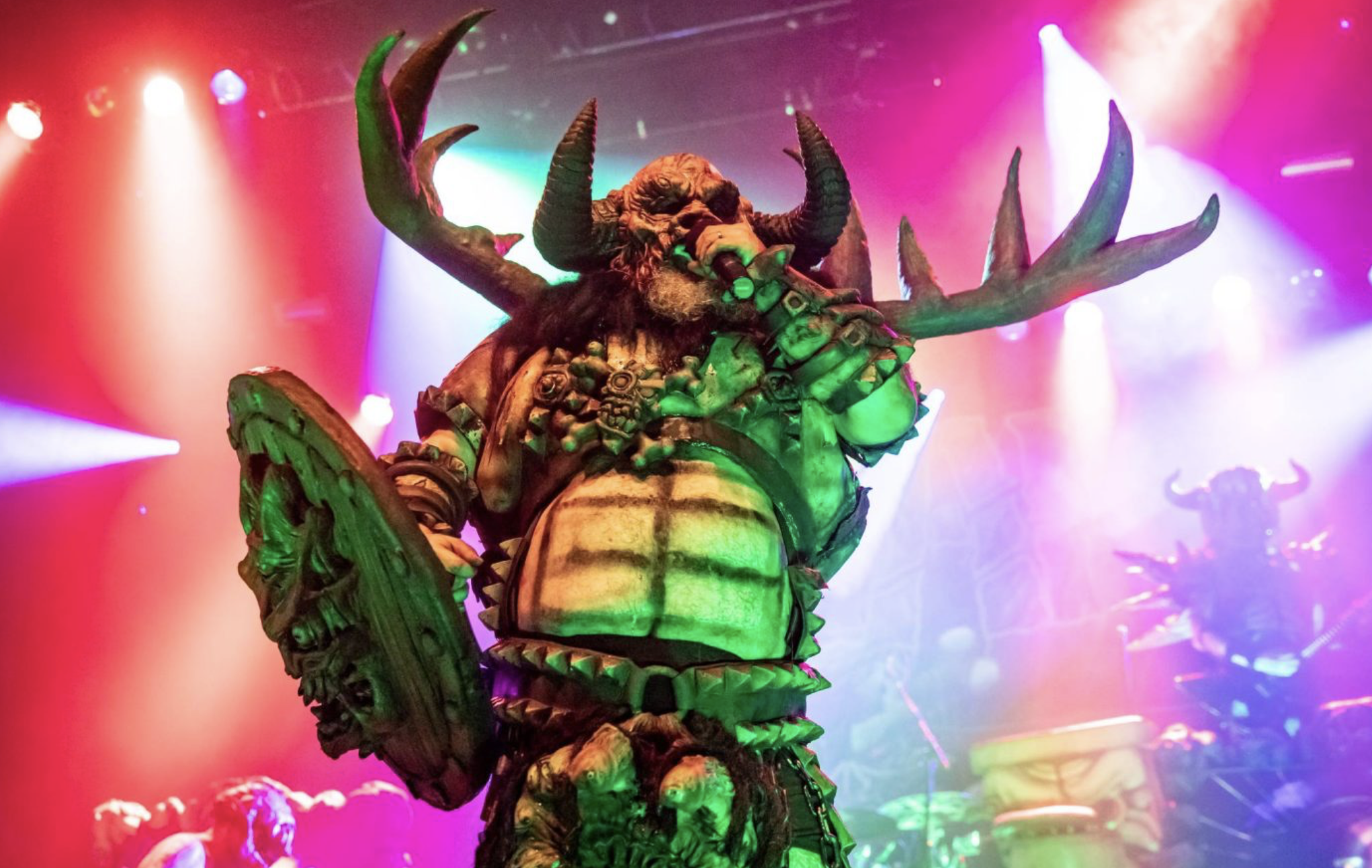 Berzerker Blothar of GWAR performing on stage.
