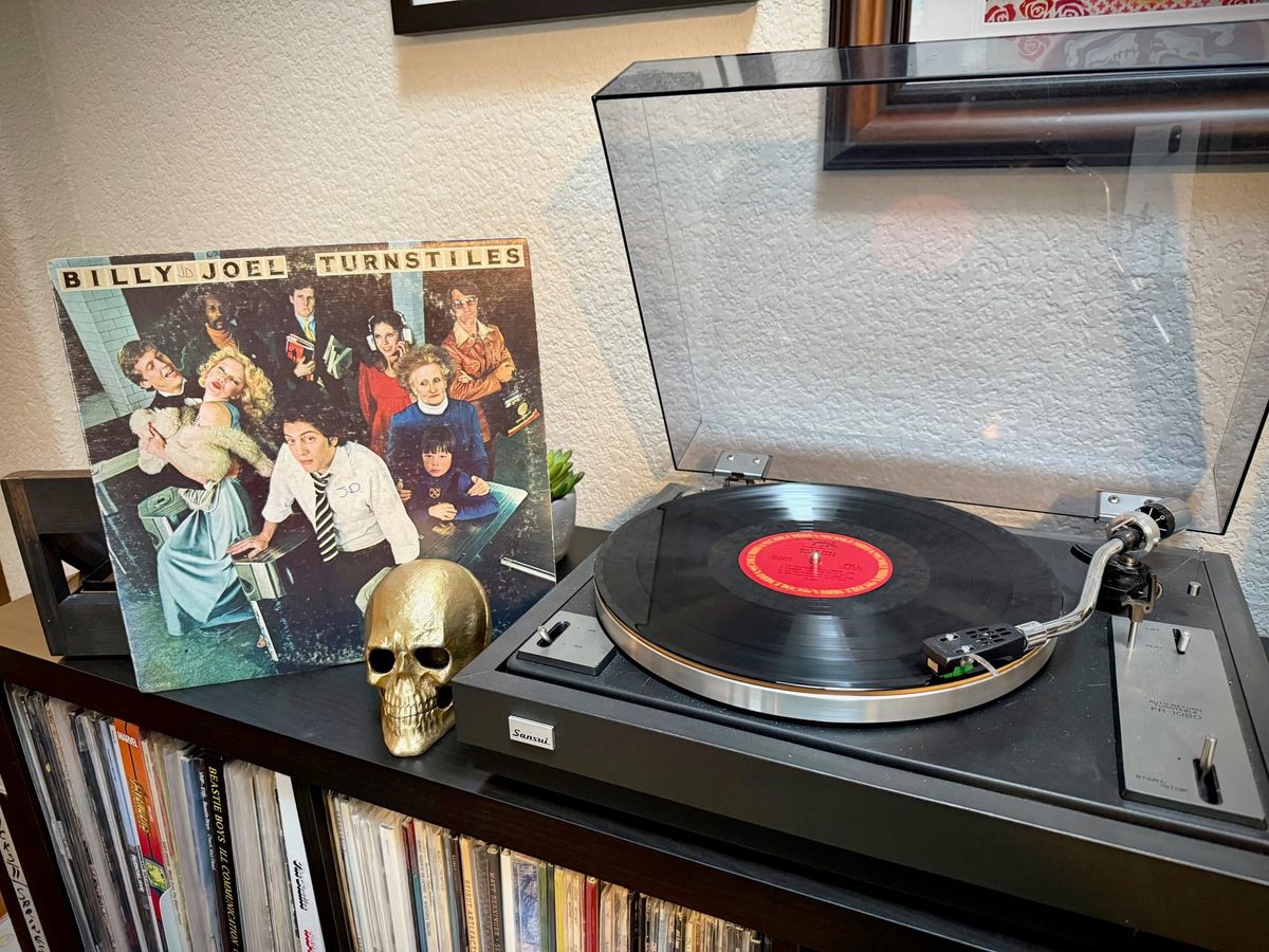 Turnstiles by Billy Joel playing on a record player.