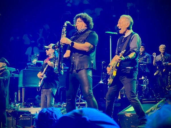 Jake Clemons and Bruce Springsteen perform on stage in Austin, TX