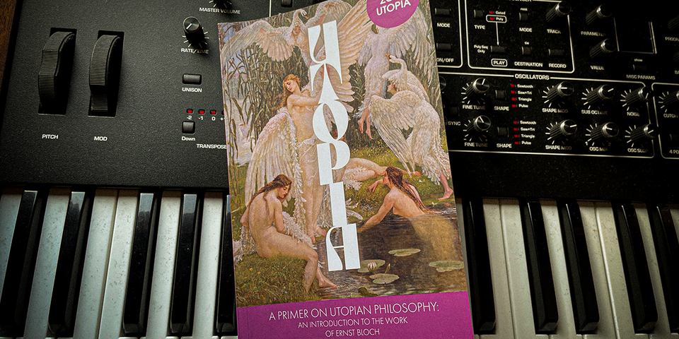 The book A Primer on Utopian Philosophy sitting on top of a worrying dusty synthesiser