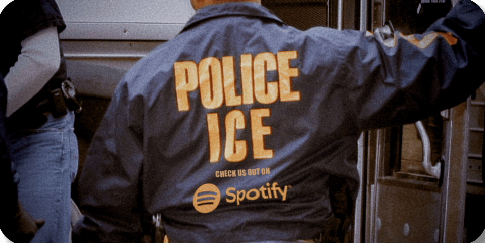 another excellent photoshop showing an ICE agent windbreaker with 'check us out on Spotify!' emblazoned on the back