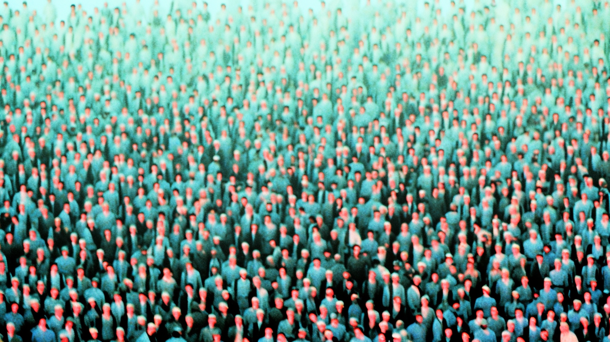 A washed-out series of dots and lines roughly equivalent to a crowd of people.