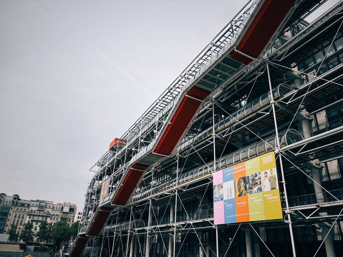 A large building which appears covered in scaffolding, reflecting the unique "inside out" architecture of the French Contemporary Art Museum.