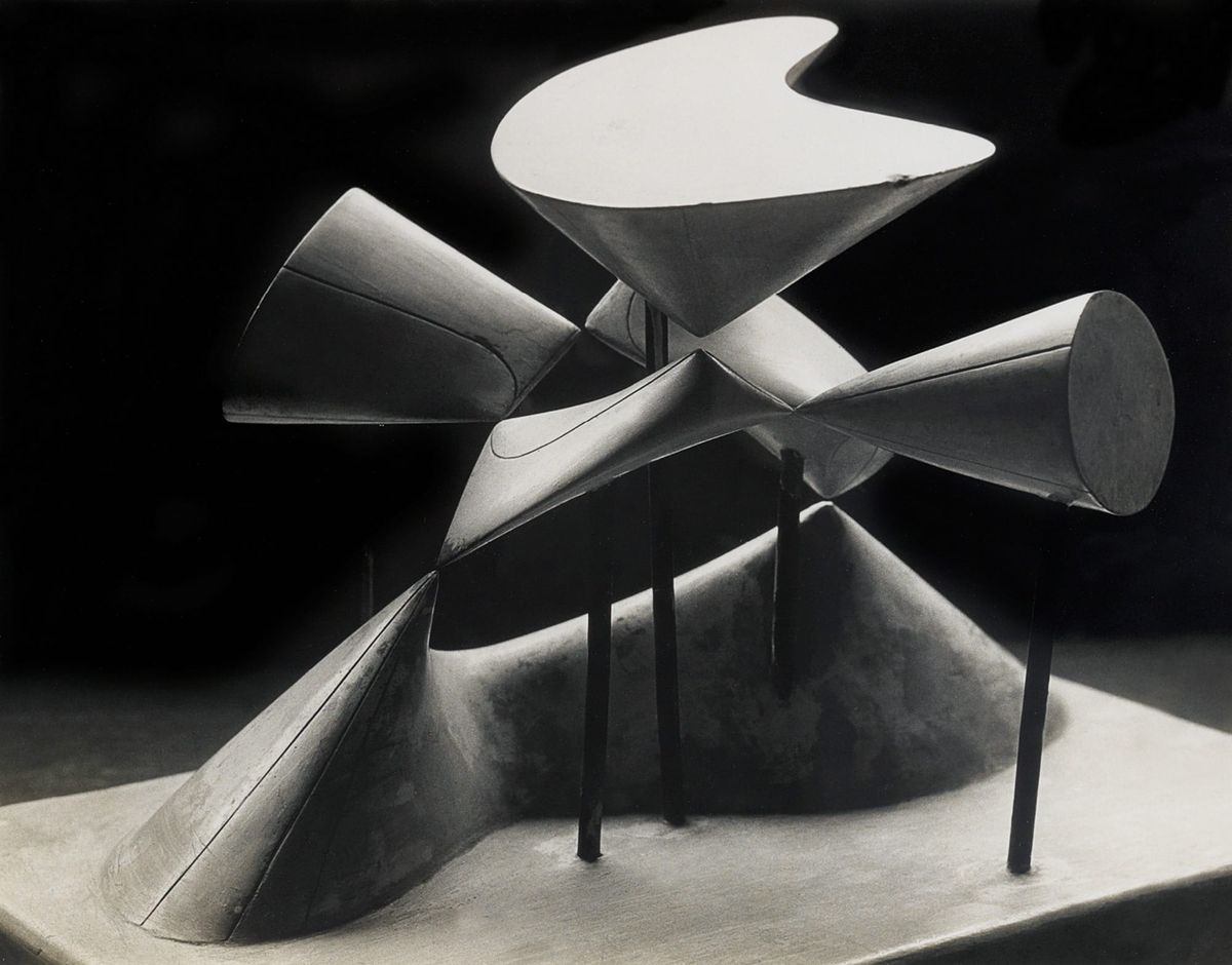 Abstract geometric form in steel, representing a mathematical concept as an object.