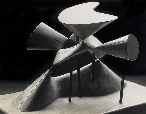 Abstract geometric form in steel, representing a mathematical concept as an object.