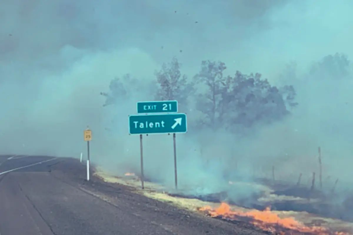Exit 2` in Oregon while wildfire smoulders. 