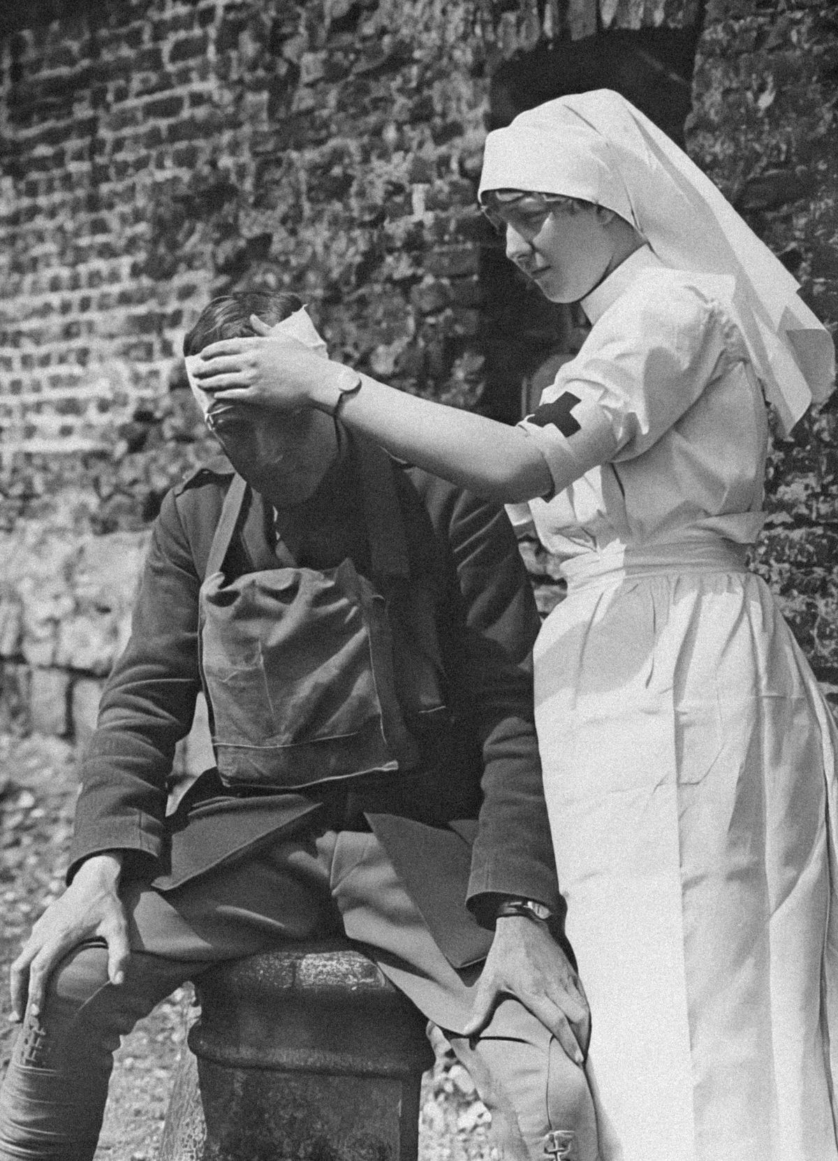 A nurse tending a wounded officer. 