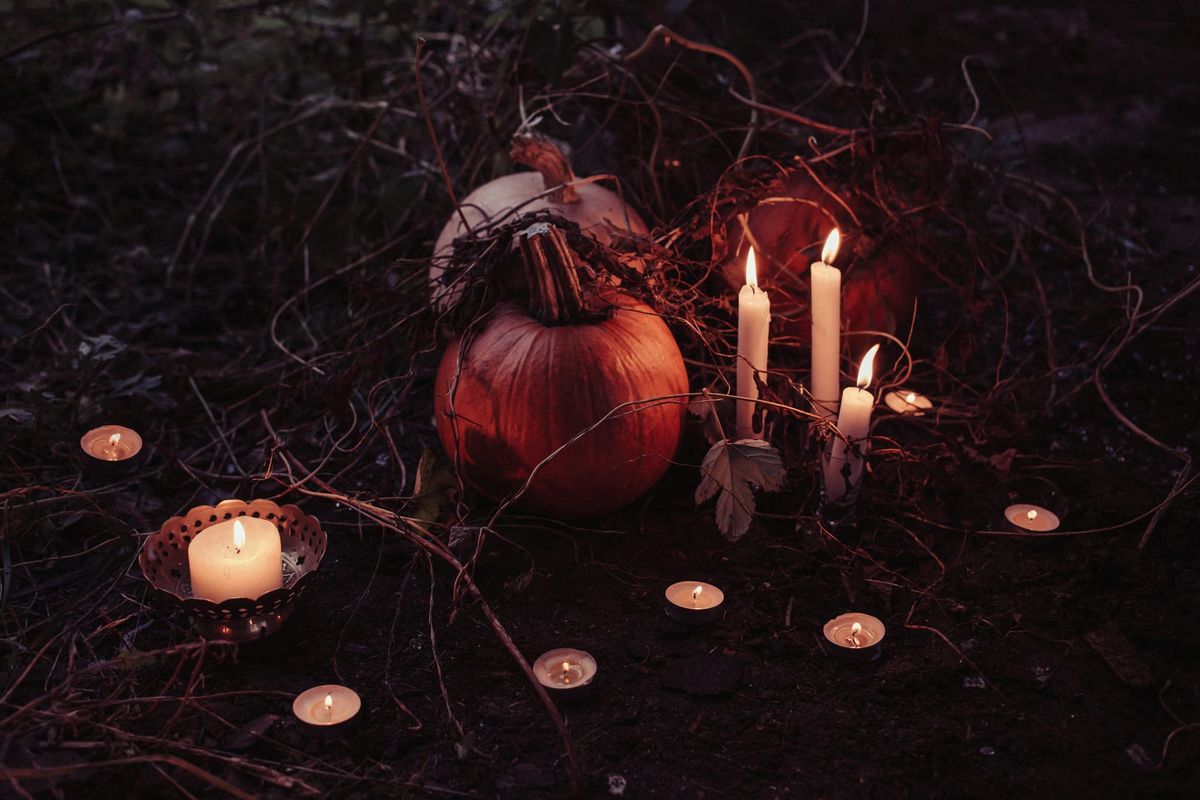 Pumpkins and Lighted Candles  