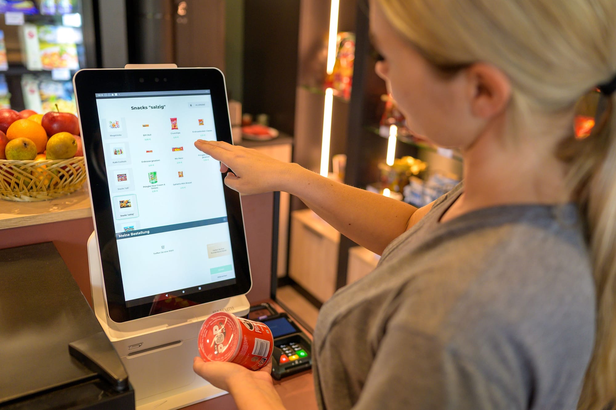 Snacks and drinks can be selected and paid for at the terminal in the marketplace.