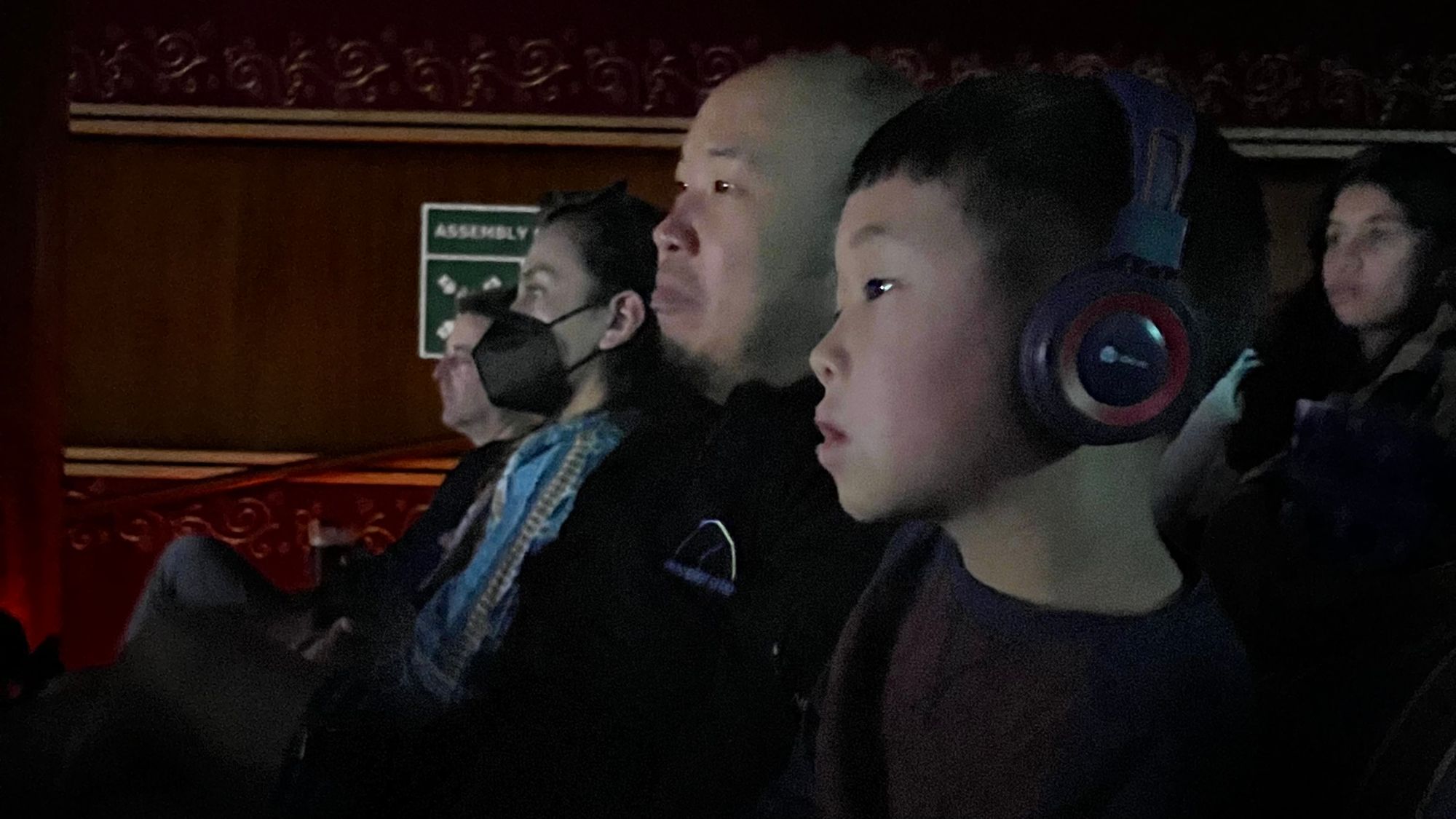 Wearing headphones at a show