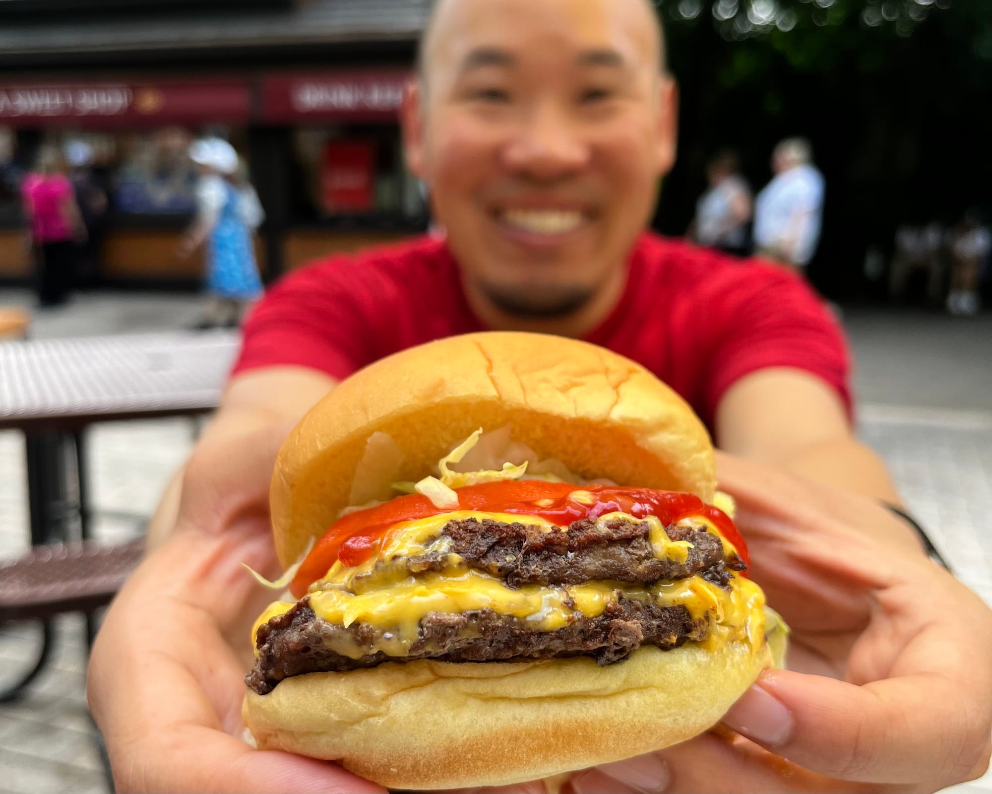 Close up of grilled cheeseburger at Bronx Zoo Asia Plaza