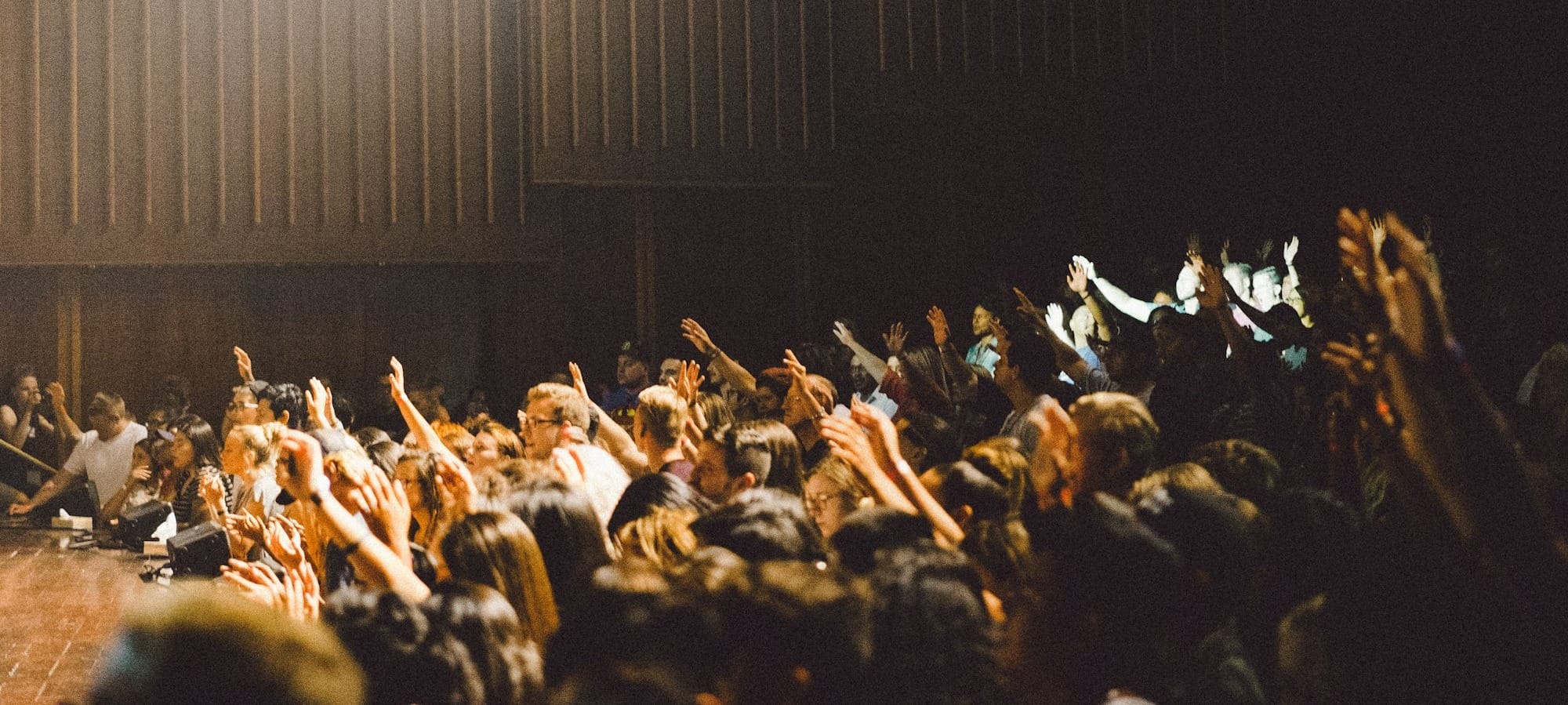 people raising their hands