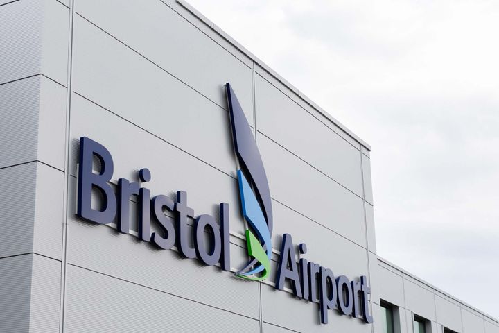Photo of the front of Bristol Airport with the airports logo