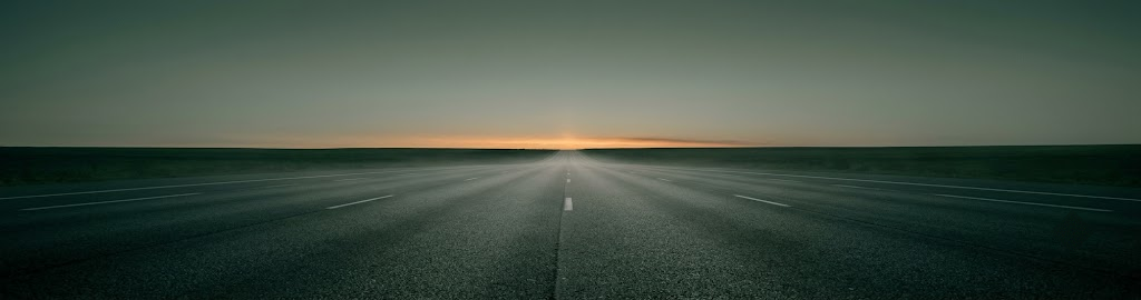 An empty multi-lane highway at dawn