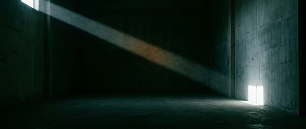 A single beam of light crossing a dark room