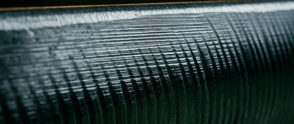 Macro detail of a milled silver bar surface